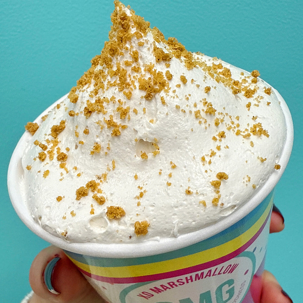 Overhead shot of cookie butter marshmallow fluff against bright teal background