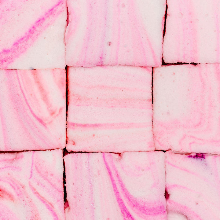a 3x3 grid of XO marshmallow's gourmet cotton candy marshmallows highlighting the pink, white, and blue swirls using natural food coloring