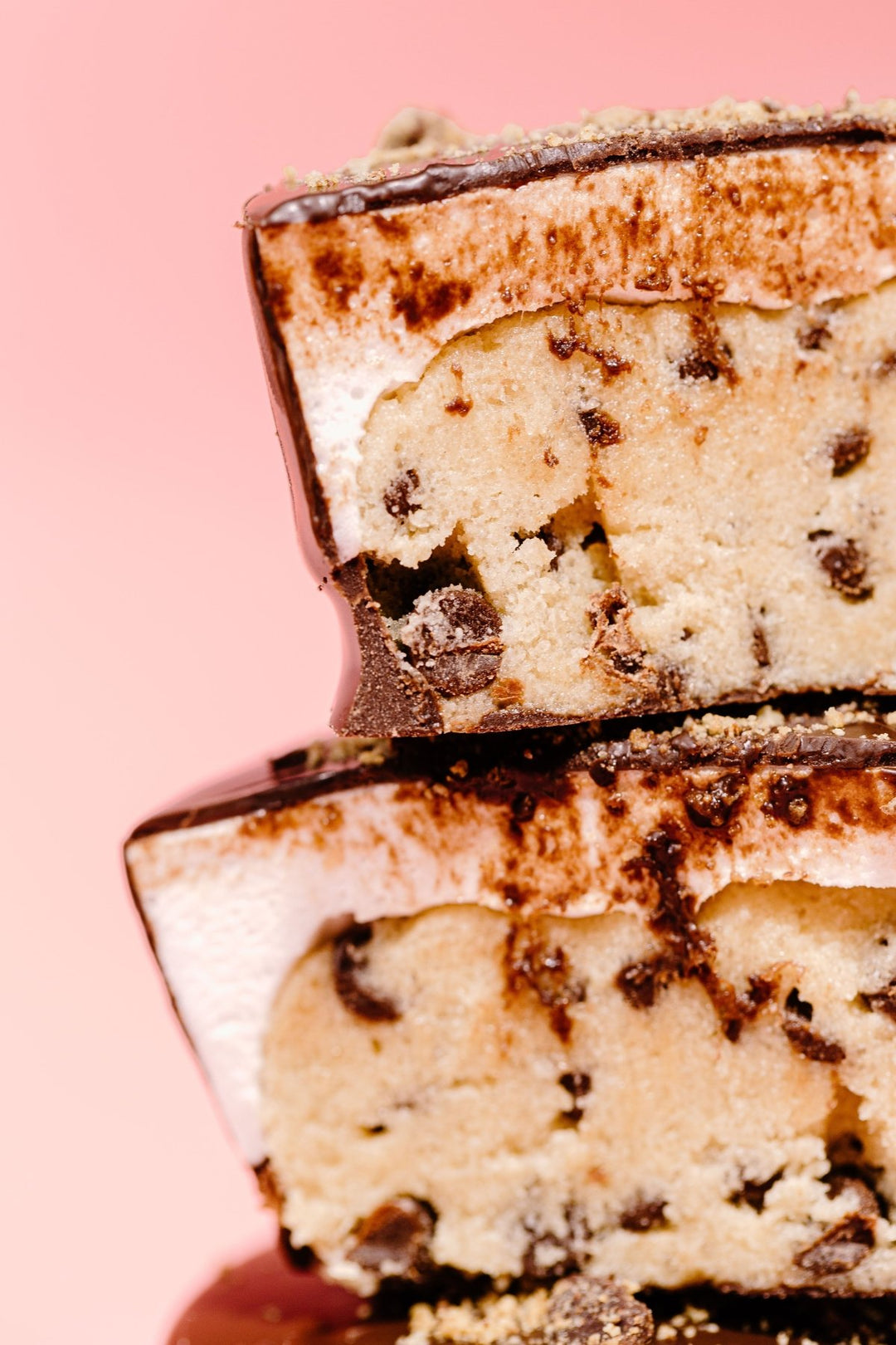 A zoomed in shot of the cookie cups on top of each other showing the edible chocolate chip cookie dough and marshmallows inside 